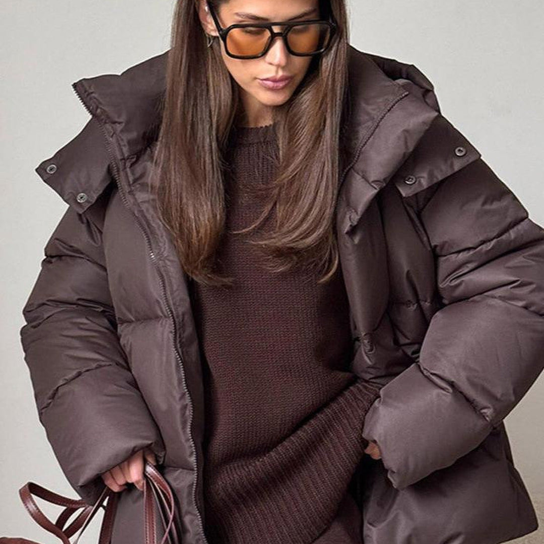 Women's hooded quilted puffer winter coat with zip front and long sleeves