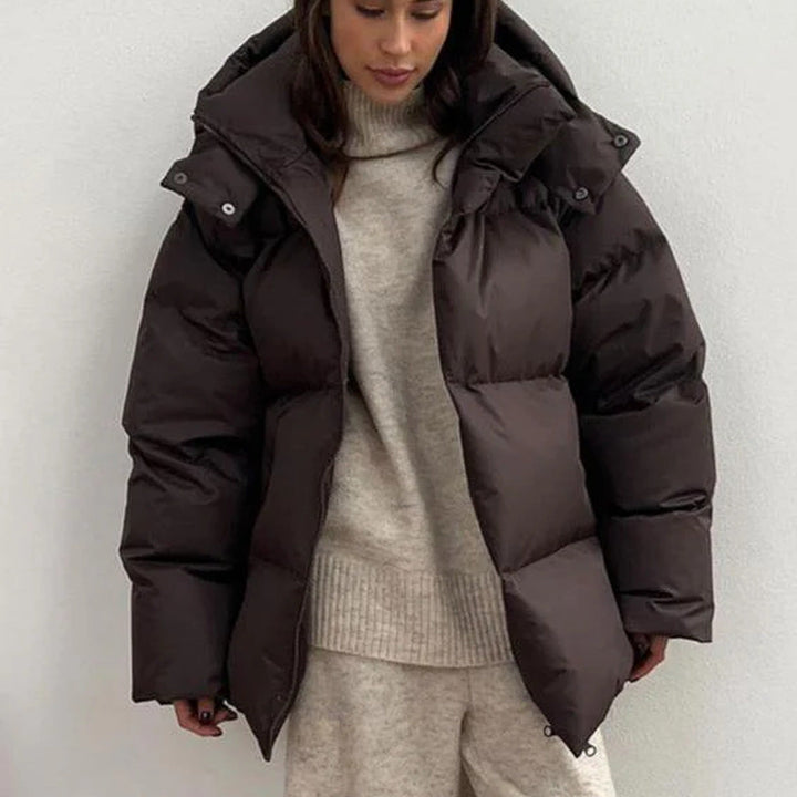Women's hooded quilted puffer winter coat with zip front and long sleeves