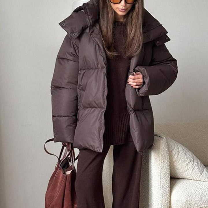 Women's hooded quilted puffer winter coat with zip front and long sleeves