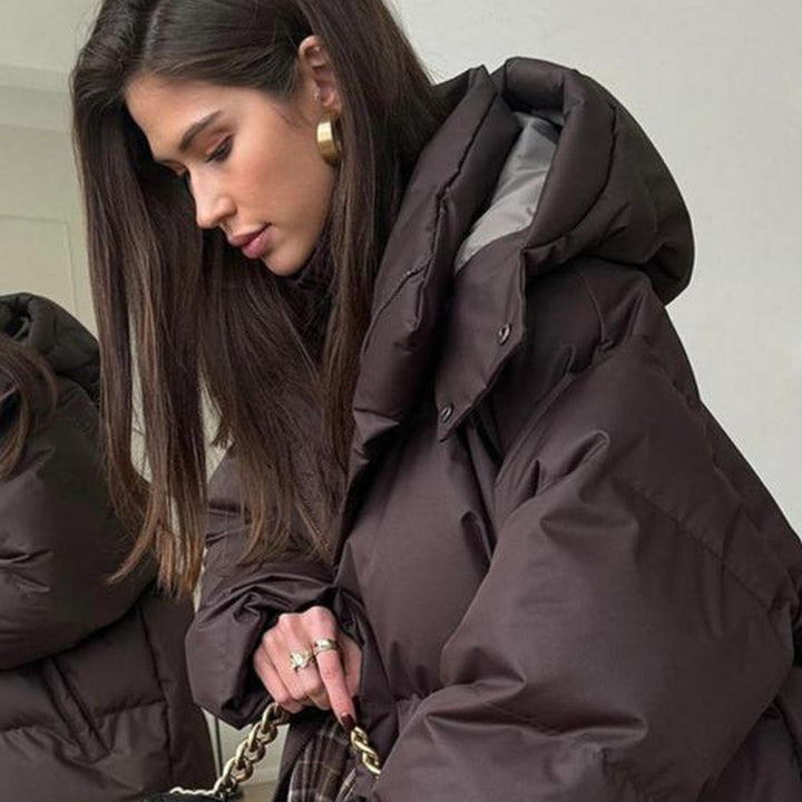 Women's hooded quilted puffer winter coat with zip front and long sleeves