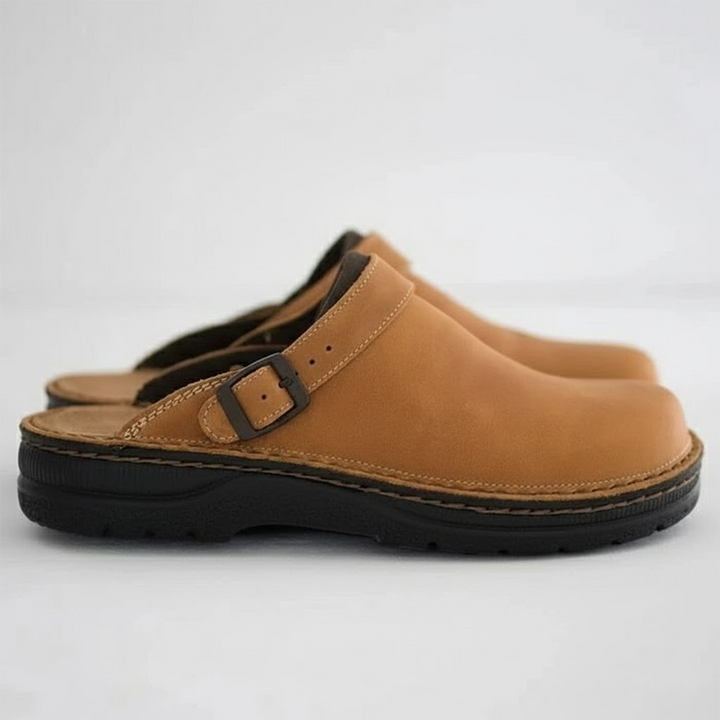 Women's leather clog mules with adjustable buckle strap and lugged sole