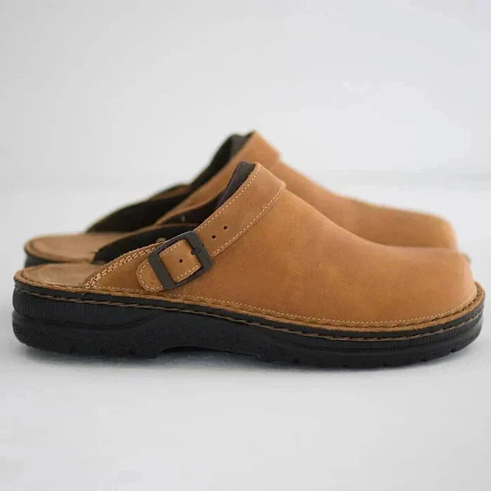 Women's leather clog mules with adjustable buckle strap and lugged sole