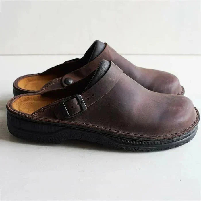 Women's leather clog mules with adjustable buckle strap and lugged sole