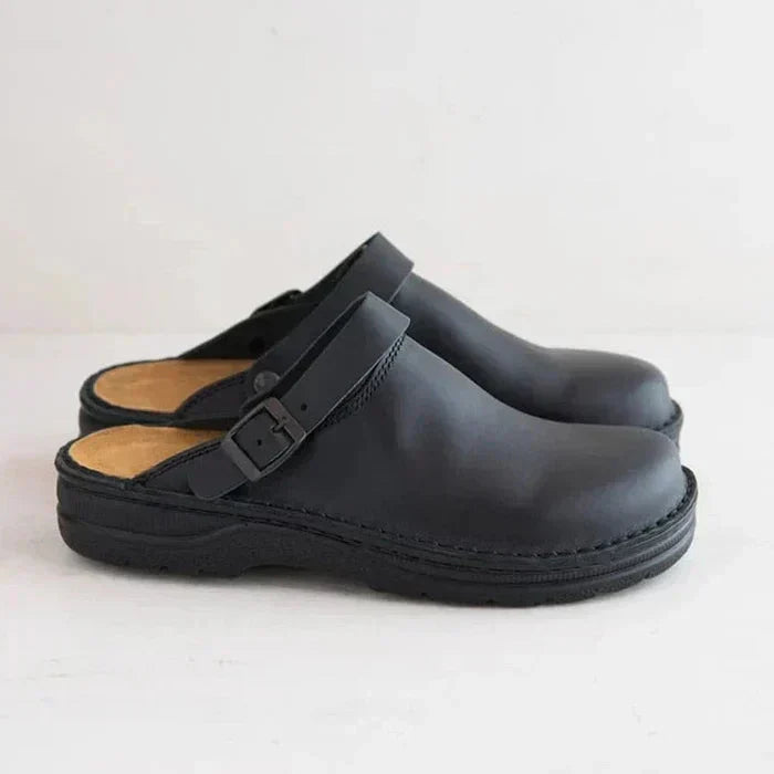 Women's leather clog mules with adjustable buckle strap and lugged sole