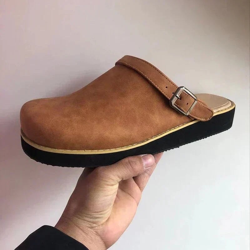 Women's leather clog mules with adjustable buckle strap and lugged sole