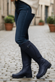 Women's knee-high riding boots with buckle detail and low heel