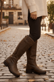 Women's knee-high riding boots with buckle detail and low heel