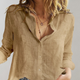 Women's long-sleeve button-up blouse with V-neck and rolled sleeves