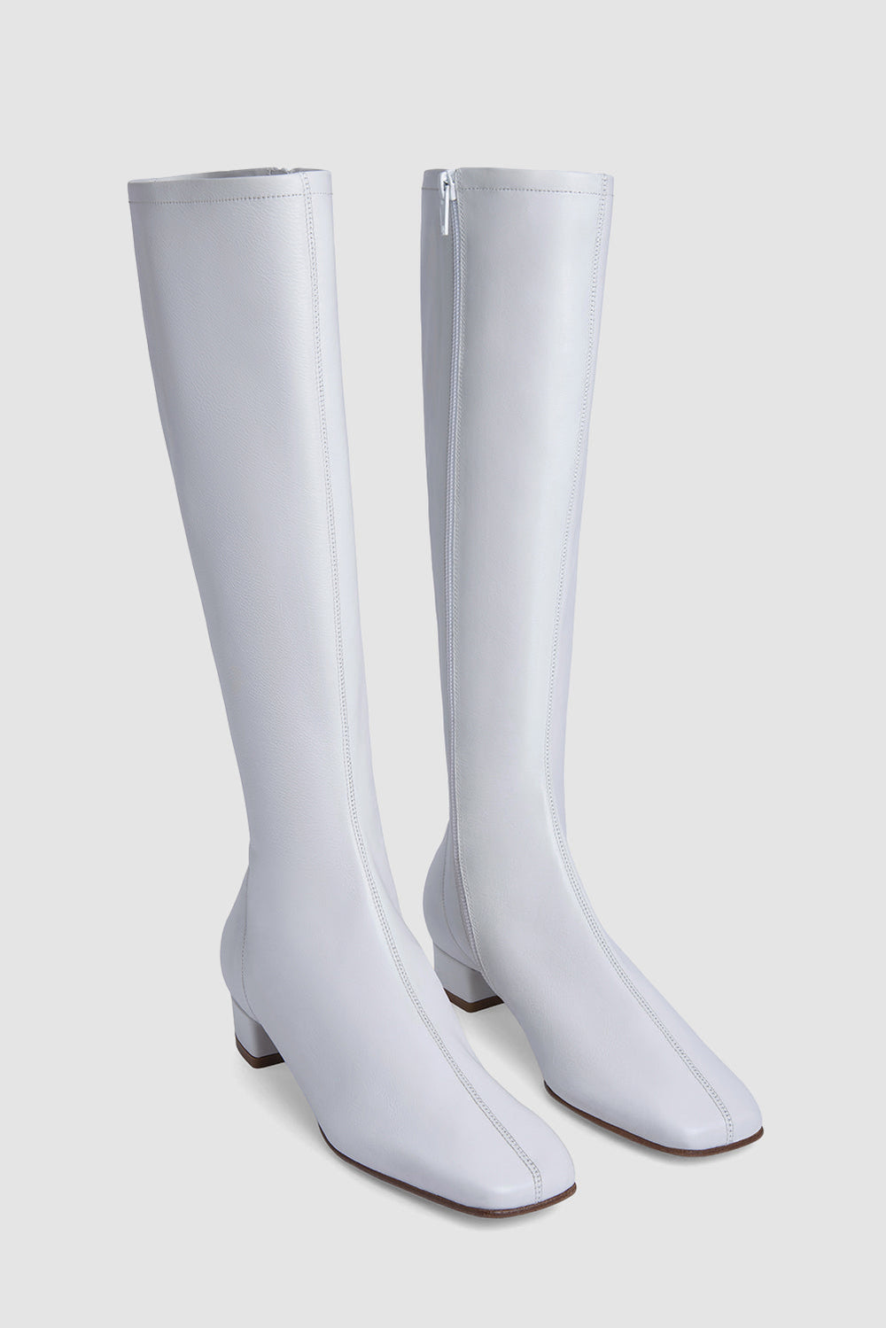 White women's knee-high boots with square toes and low block heels