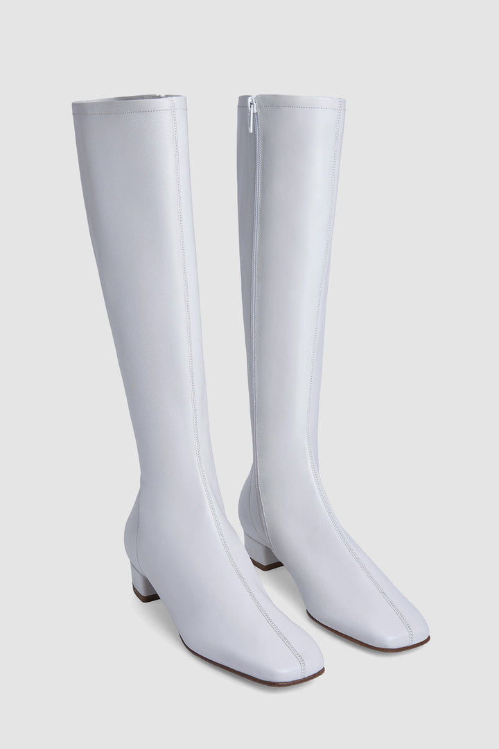 White women's knee-high boots with square toes and low block heels