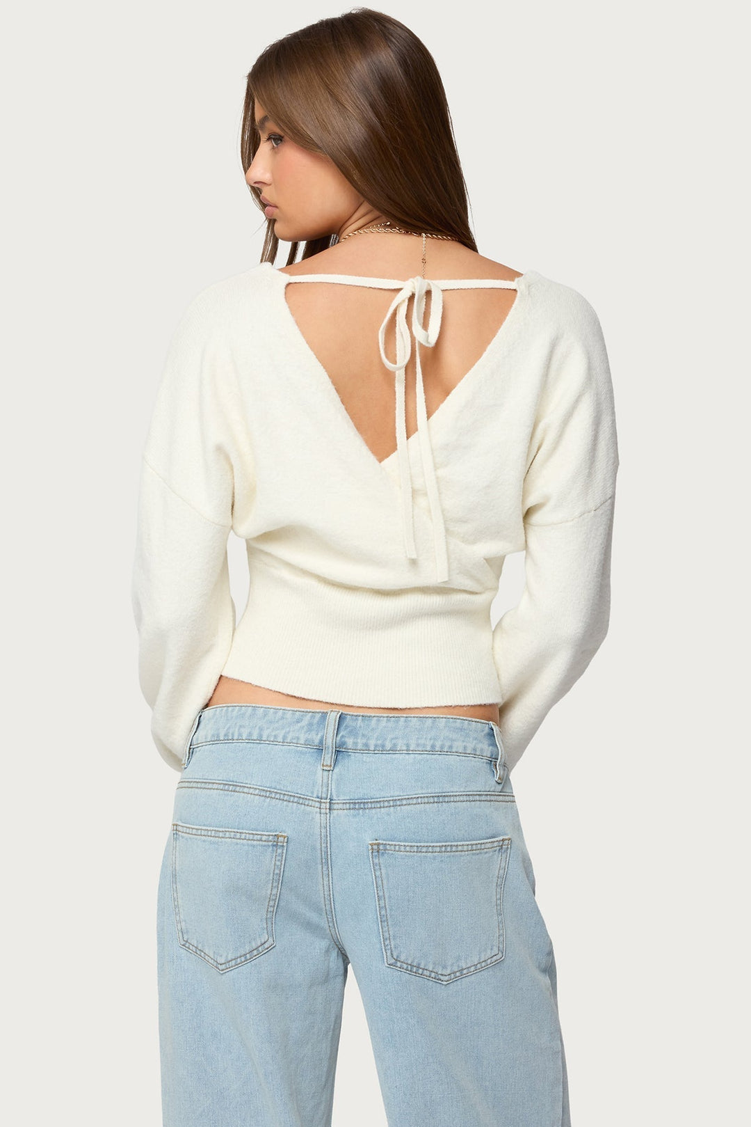 Women's wrap sweater with V-neckline and cropped ribbed hem