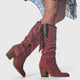Women's tall cowboy boots with side zippers, fringe detailing, pointed toes and block heels