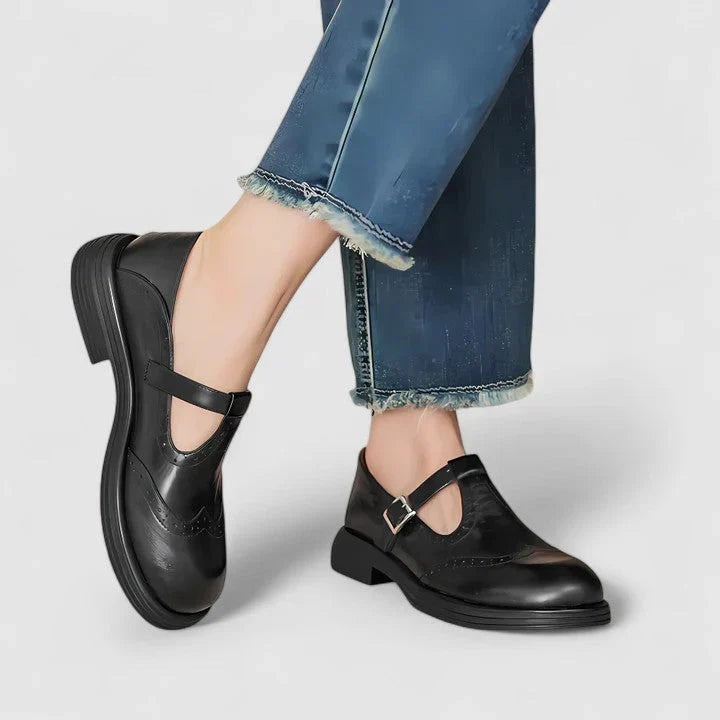 Women's brown and black brogue Mary Jane flats with buckle straps and low heels