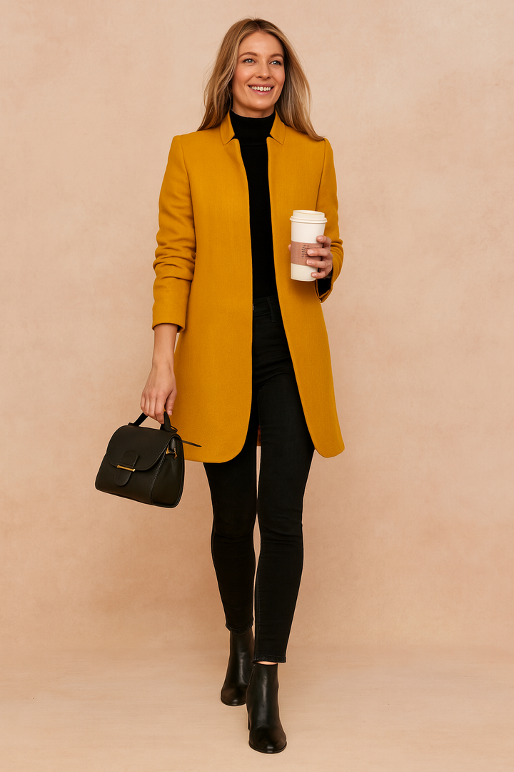 Women's minimalist knee-length coat with high collar and long sleeves