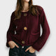 Women's burgundy textured knit cardigan with buttons and front patch pockets
