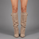 Women's black faux leather over-the-knee boots with buckle detail