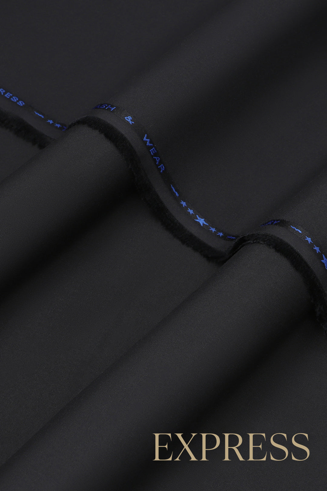 Close-up of solid wash and wear suit fabric with blue branded trim