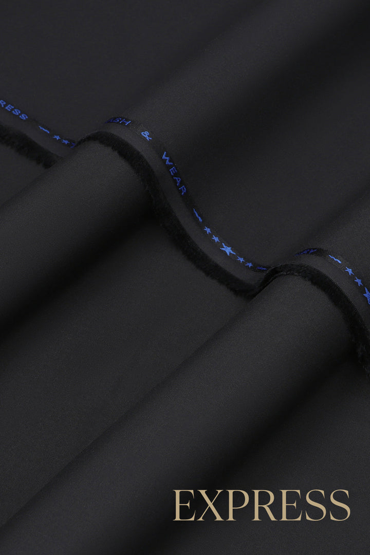 Close-up of solid wash and wear suit fabric with blue branded trim
