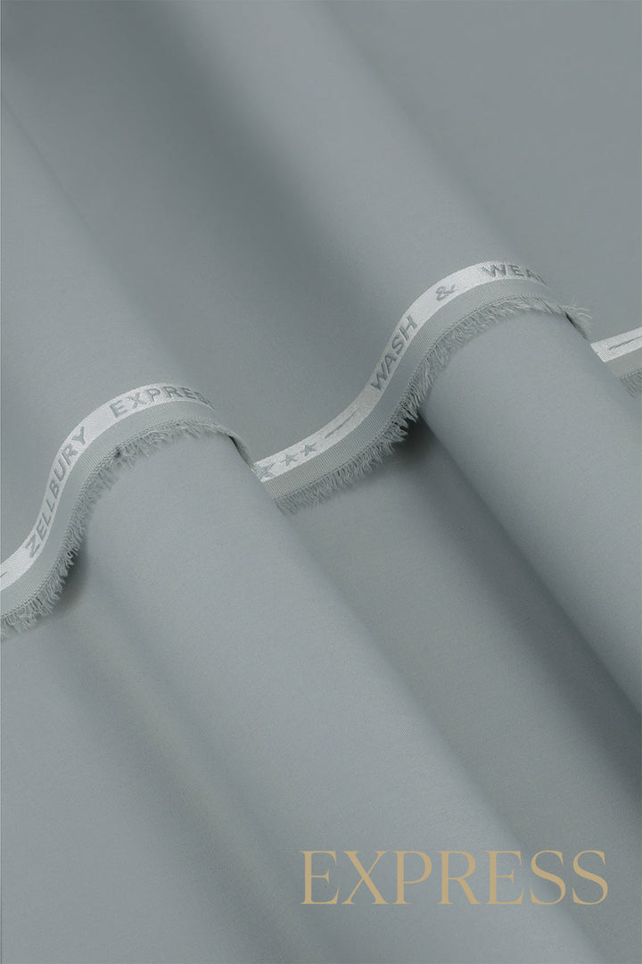 Close-up of solid wash and wear suit fabric with blue branded trim