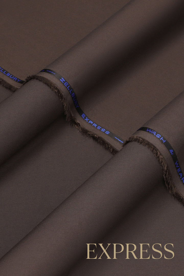 Close-up of solid wash and wear suit fabric with blue branded trim