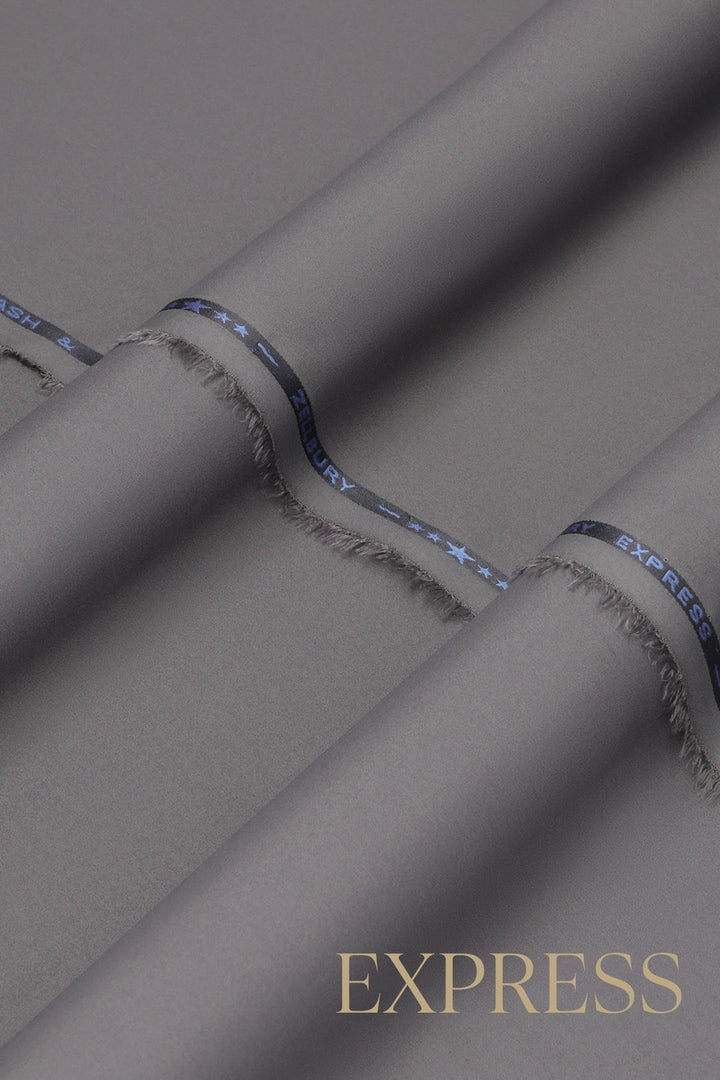 Close-up of solid wash and wear suit fabric with blue branded trim