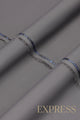 Close-up of solid wash and wear suit fabric with blue branded trim