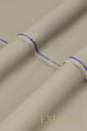 Close-up of solid wash and wear suit fabric with blue branded trim
