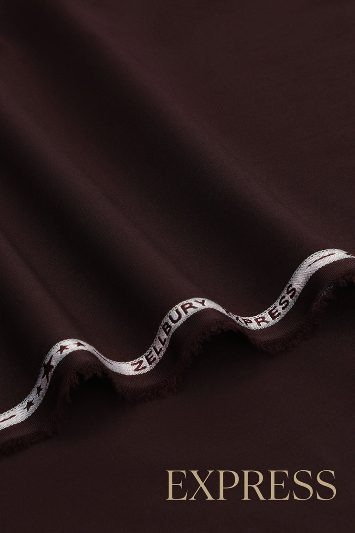 Close-up of solid wash and wear suit fabric with blue branded trim