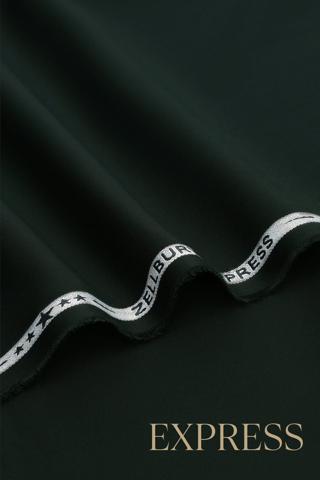 Close-up of solid wash and wear suit fabric with blue branded trim