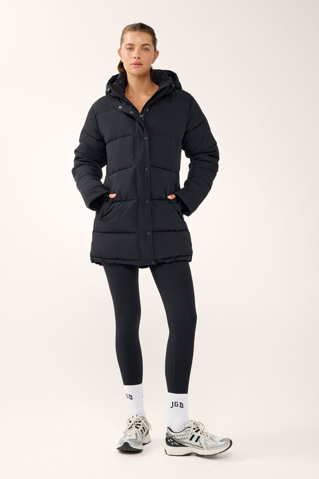 Black women's quilted hooded puffer jacket with long sleeves