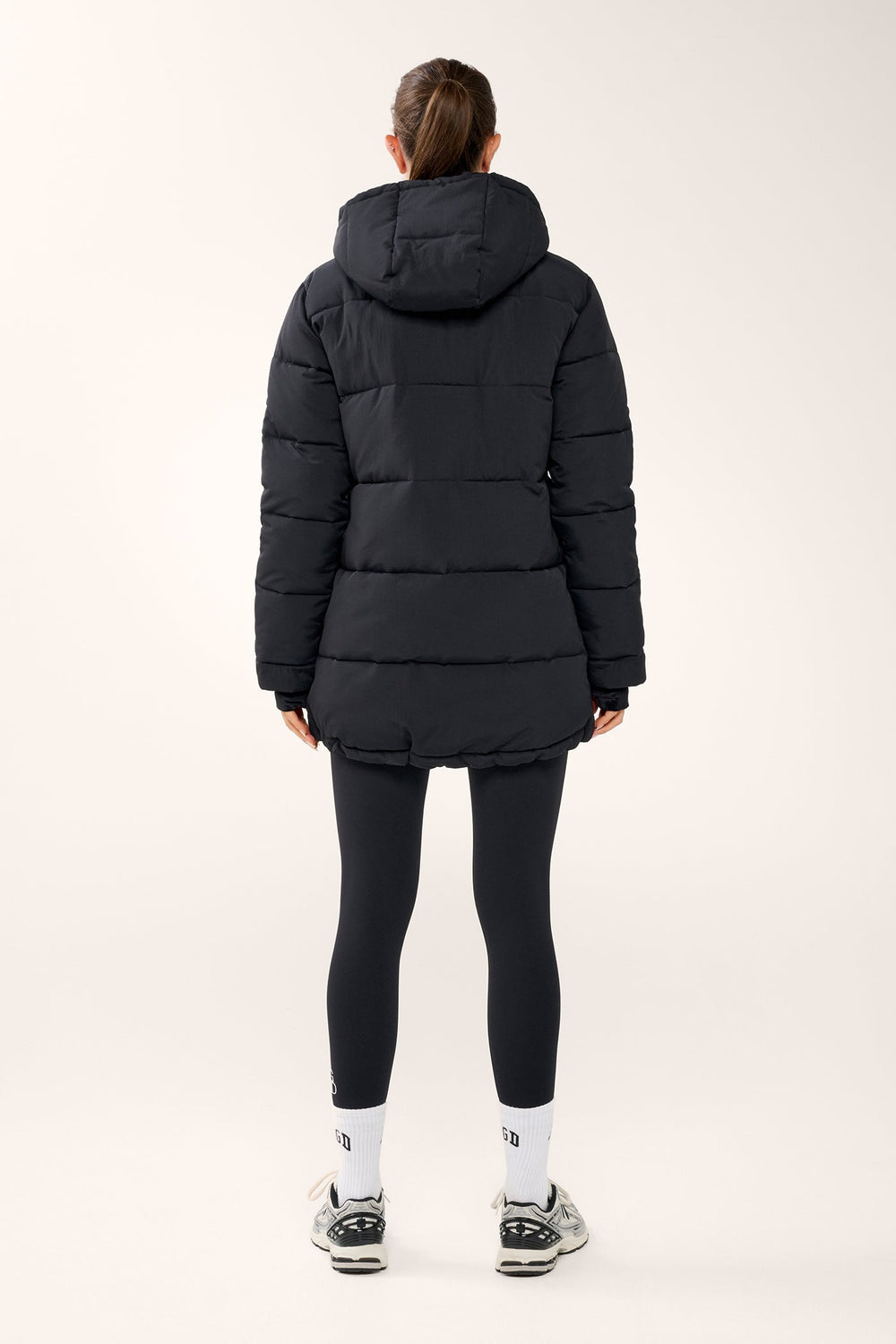 Black women's quilted hooded puffer jacket with long sleeves