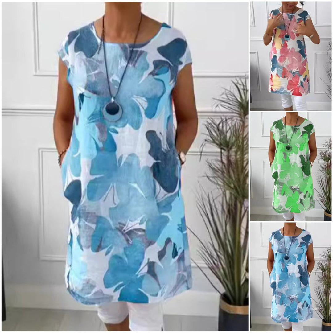 Women's floral print shift dress with short sleeves, crew neck and mid-calf hem