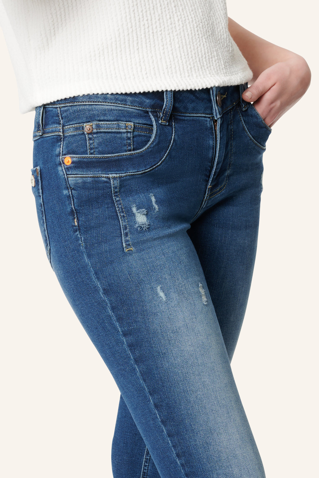 Women's blue low-rise slim fit jeans with ankle-length legs