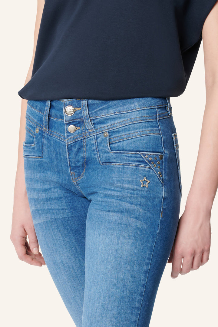 Women's blue slim fit jeans with studded rear pocket detail