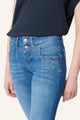 Women's blue slim fit jeans with studded rear pocket detail