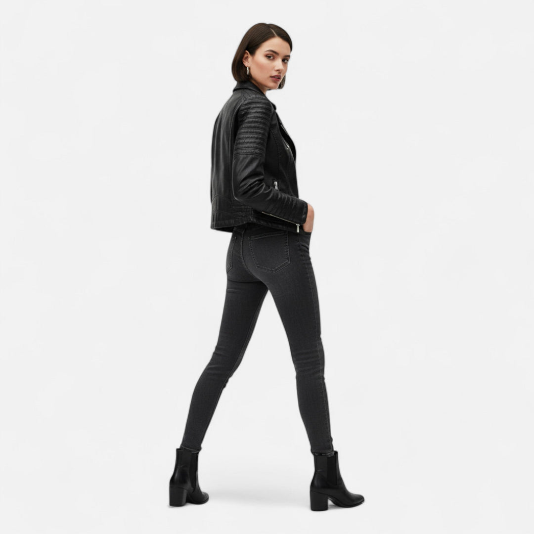 Women's black biker jacket with diagonal zip front and quilted sleeves