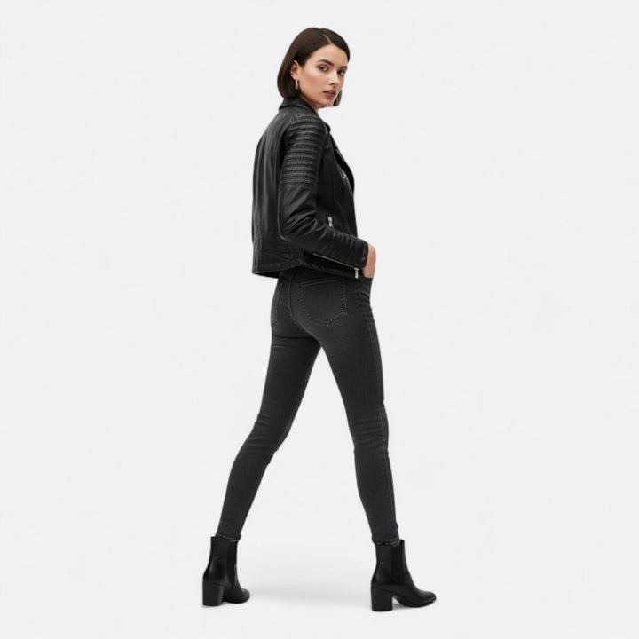 Women's black biker jacket with diagonal zip front and quilted sleeves