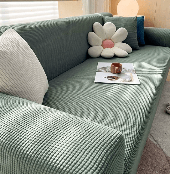 Textured stretch sofa slipcover on living room seating