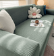 Textured stretch sofa slipcover on living room seating