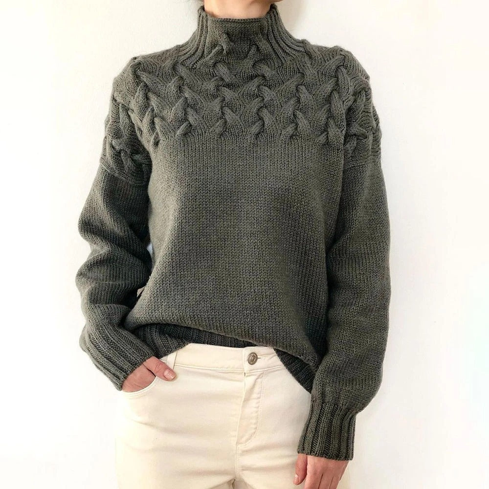 Women's cable knit turtleneck sweater with long sleeves and ribbed trims
