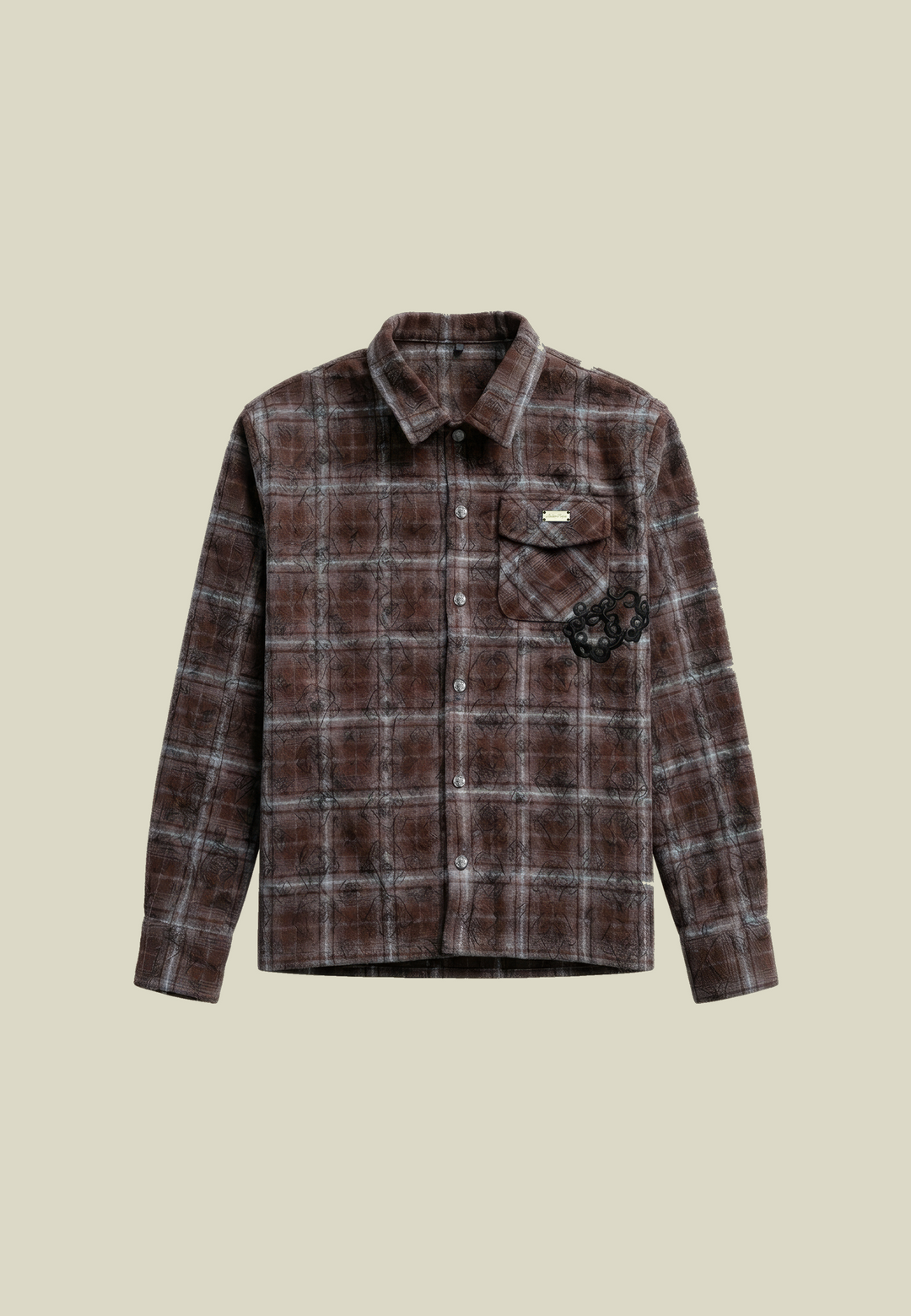Brown plaid flannel shirt with long sleeves and decorative detailing