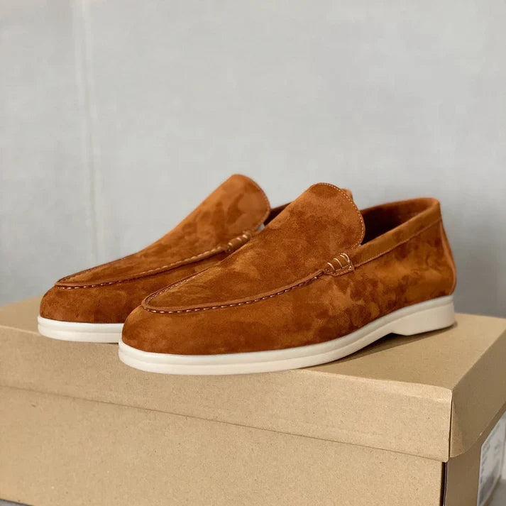 Slip-on loafers with moc-toe stitching and flat contrasting soles