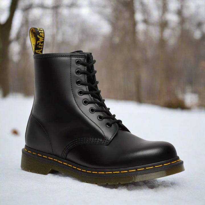 Men's ankle-height combat boot with black laces, round toe and lug sole