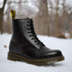 Men's ankle-height combat boot with black laces, round toe and lug sole