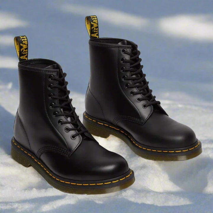 Men's ankle-height combat boot with black laces, round toe and lug sole