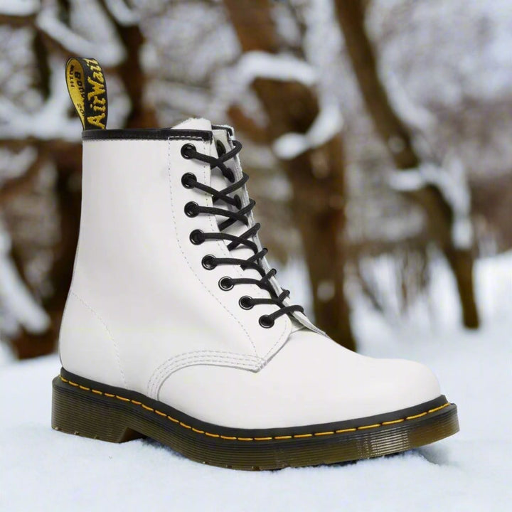 Men's ankle-height combat boot with black laces, round toe and lug sole