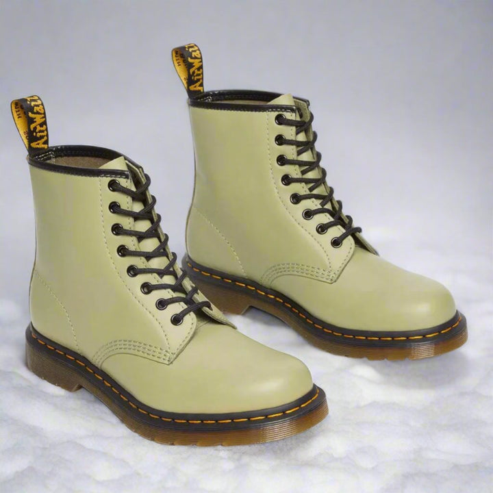 Men's ankle-height combat boot with black laces, round toe and lug sole