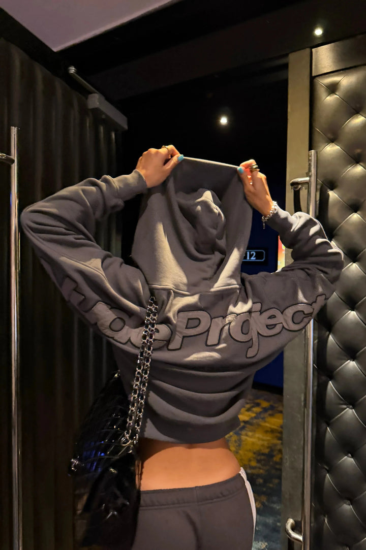 Unisex dark graphic zip-up hoodie with hood and ribbed cuffs