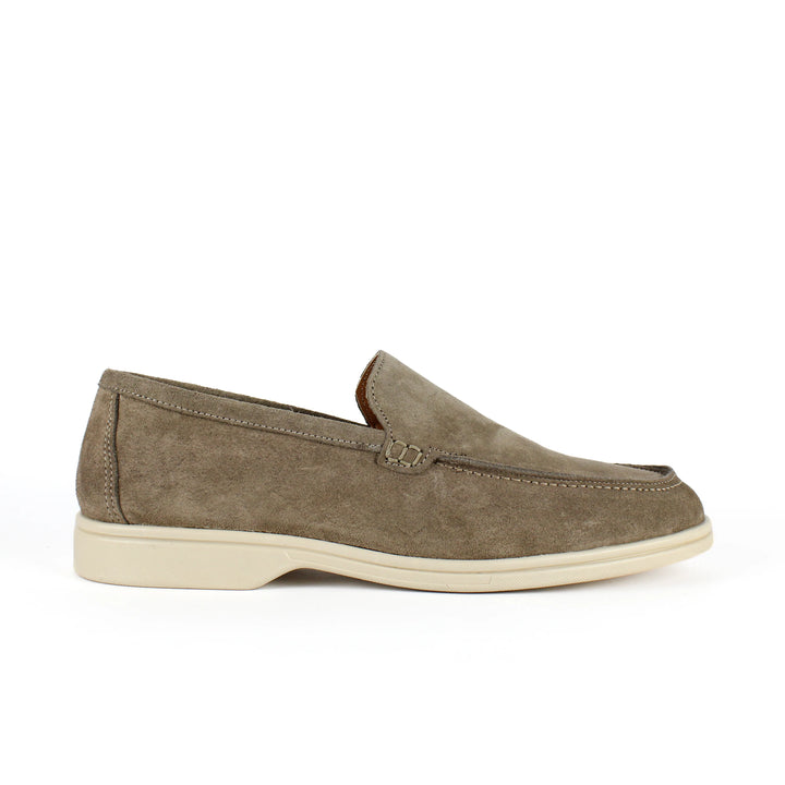 Beige moccasin loafers with rounded toes, stitched detailing and low soles