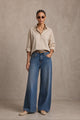 Women's blue wide leg jeans with high-rise waist and braided pocket trim